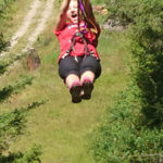 Photo Gallery: Girl Zip Lining During Team Day