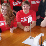 Photo Gallery: Red Team Gathered by the Table During Team Day