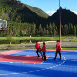 Photo Gallery: Teens Playing Basketball During Team Day