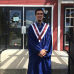 Photo Gallery: Proud Teen Graduate Outside of Schoolhouse