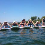 teens making a line of surfboards