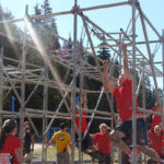 Photo Gallery: Teens Attempting to Get Through Climbing Obstacle During Mudd, Sweat, and Tears