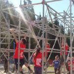 Photo Gallery: Teens Navigating Obstacle Course During Mudd, Sweat, and Tears