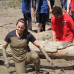 Photo Gallery: Female Teen Crawling Through Mud During Our Mudd, Sweat, and Tears Event