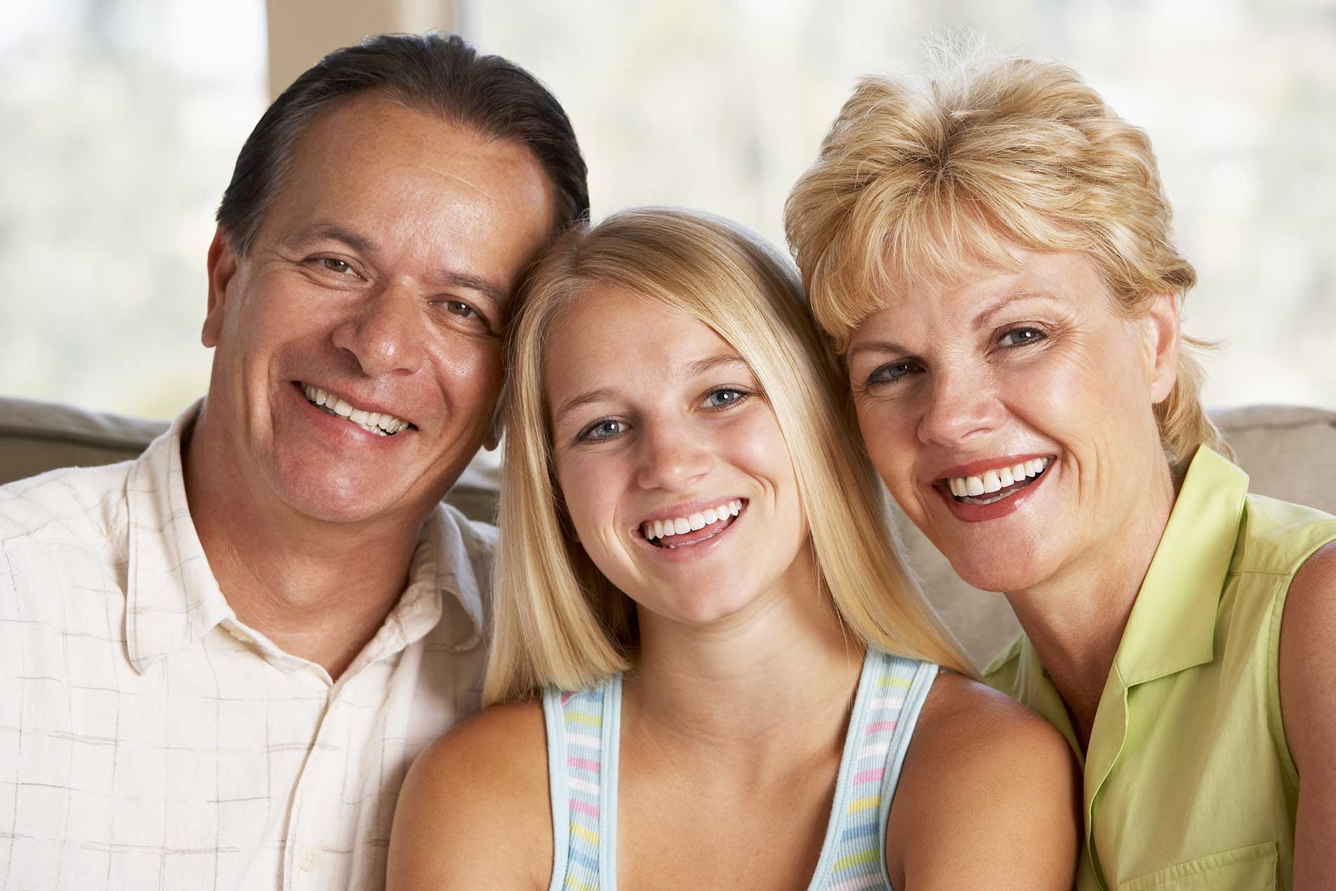 smiling girl with her parents