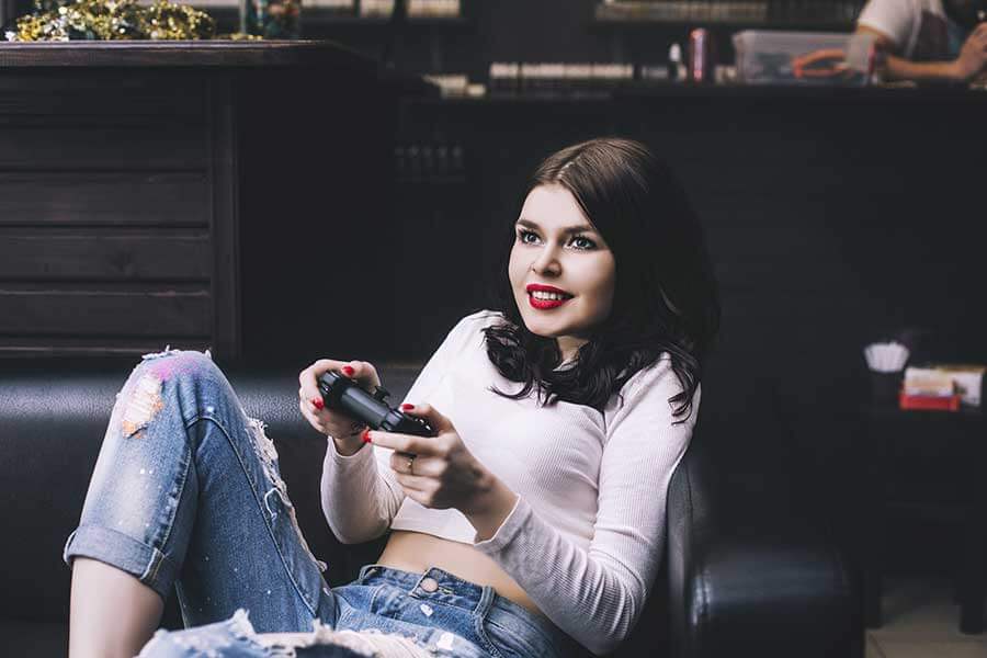 a girl holds a video game controller not understanding gaming addiction