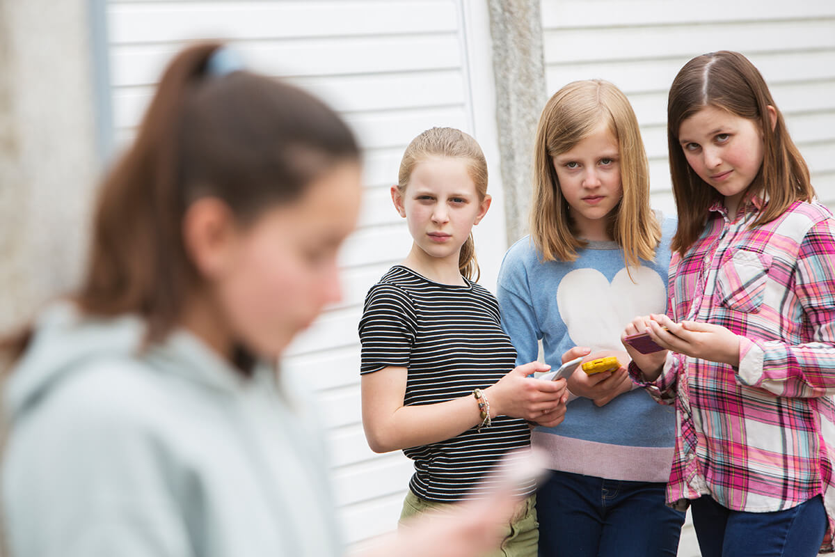 cyberbullying teens on their phones