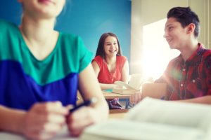 students sit in a classroom during teen trauma treatment