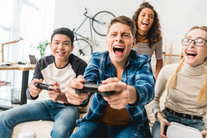 a group of teens gaming because of video game addiction
