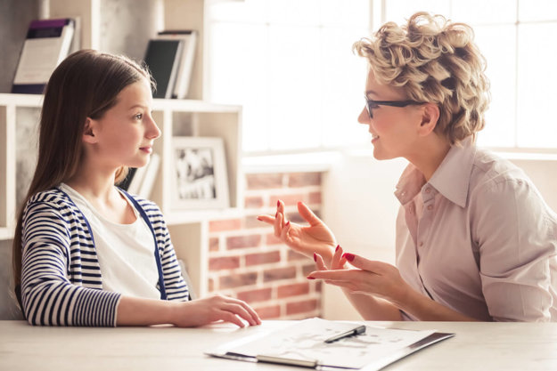 therapist talking with teen about Mental Health Disorders in Kids