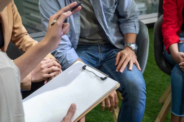 teens attend a group therapy session