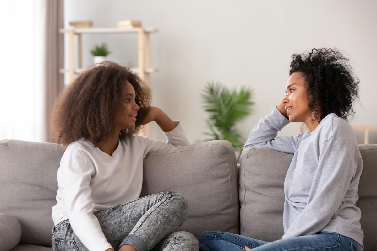 two-people-on-a-couch-discussing-self-esteem-in-teens