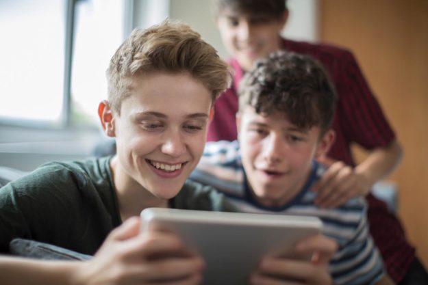 teens-playing-video-games-while-thinking-what-is-a-process-addiction