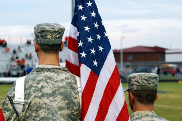 troubled teens thrive in military school in full uniform with an american flag