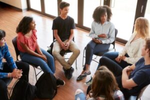 teens meet for a group therapy session within their alcohol detox centre