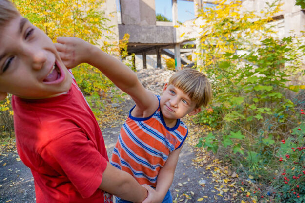 an autistic child hits another child